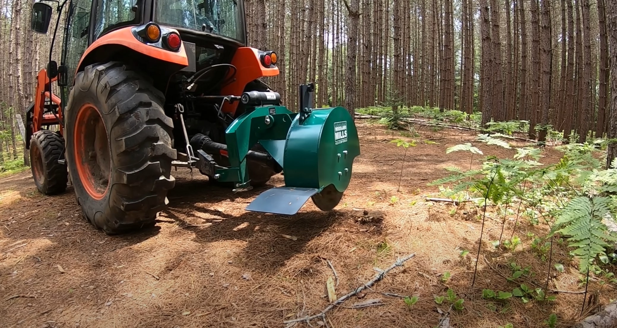 Stump grinding equipment operating in forested area in Queen Creek